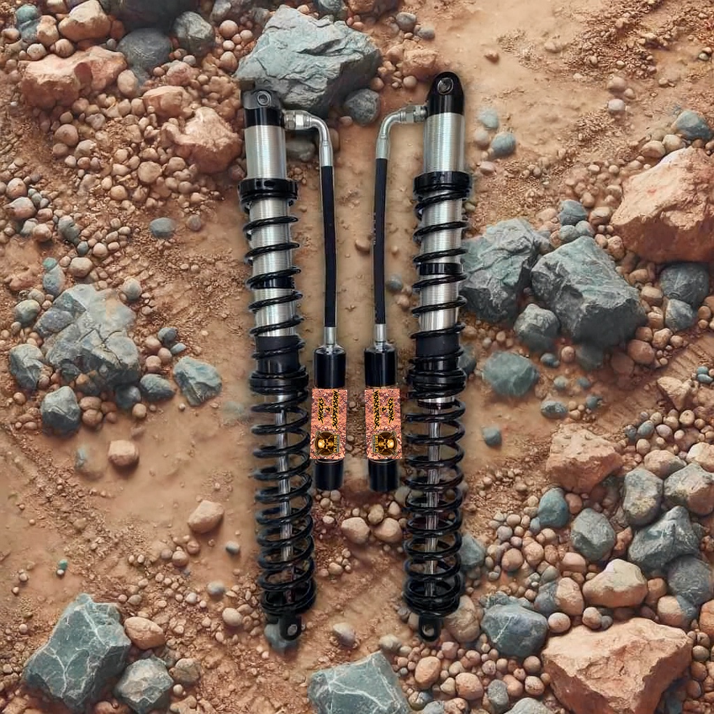 Coilover pair with external reservoirs on rocky ground